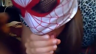 Masked Brunette girl Sucking Cock