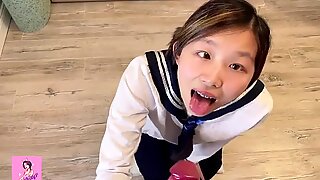 Asian teen in Japanese schoolgirl uniform gets drilled from behind while watching hentai